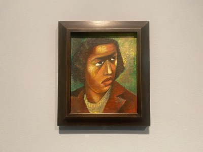 A painting of a Black woman wearing a red coat.