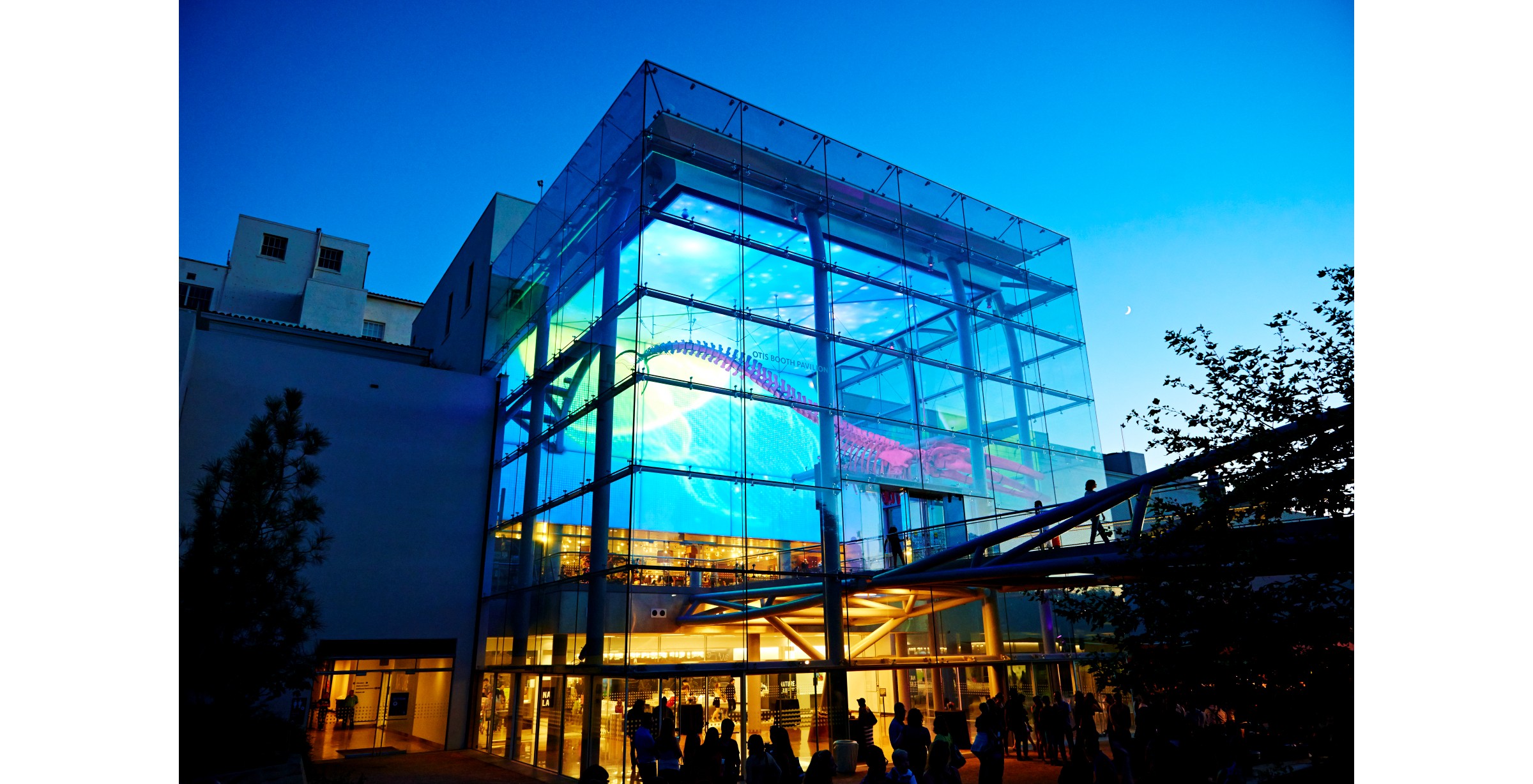 An exterior image of the Natural History Museum of Los Angeles County showing a dinosaur skeleton.