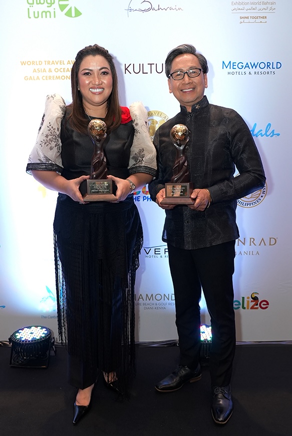 Megaworld Hotels & Resorts wins 2 major awards: Philippines Leading Hotel Group and Savoy Hotel Manila bagging the Philippines Leading Airport Hotel. In photo are Cleofe Albiso, Managing Director of MHR, and Den Navarro, General Manager of Savoy Hotel Manila