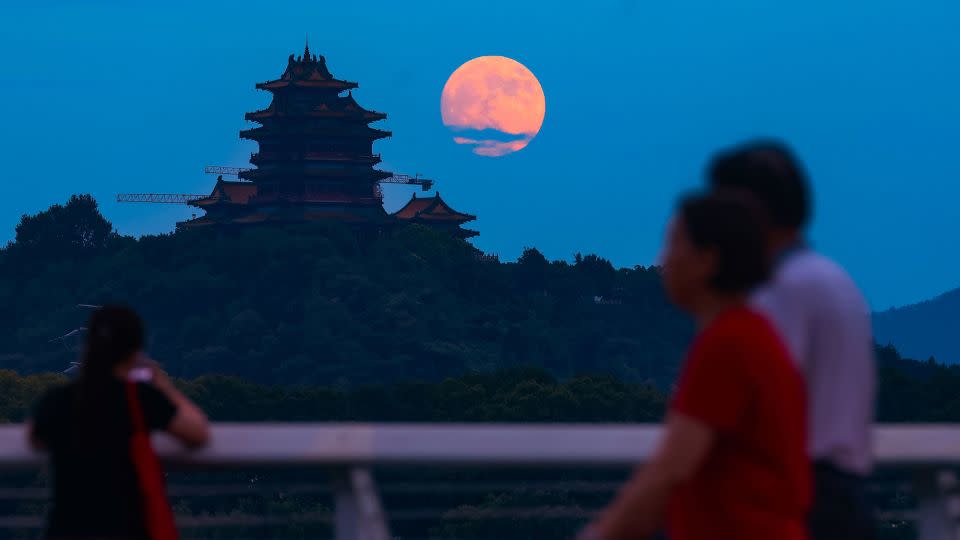 The moon rises in the sky Tuesday in Nanjing, China. Mid-Autumn Festival, which celebrates the moon, fell on September 17 this year. - Yang Bo/China News Service/VCG/Getty Images