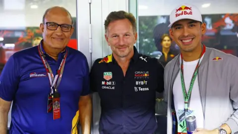 Getty Images S. Iswaran, Transport Minister for Singapore, Red Bull Racing Team Principal Christian Horner and Prince Jefri Ibrahim pose for a photo on October 2022