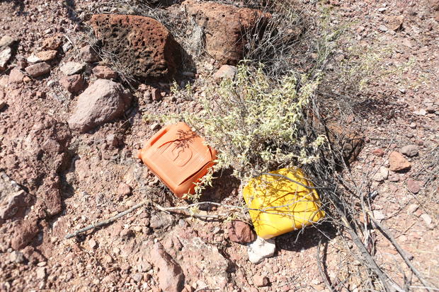 In the desert, volunteers often find water containers and other items left behind by migrants. Sometimes, humanitarian workers also leave water for migrants traversing this area. 