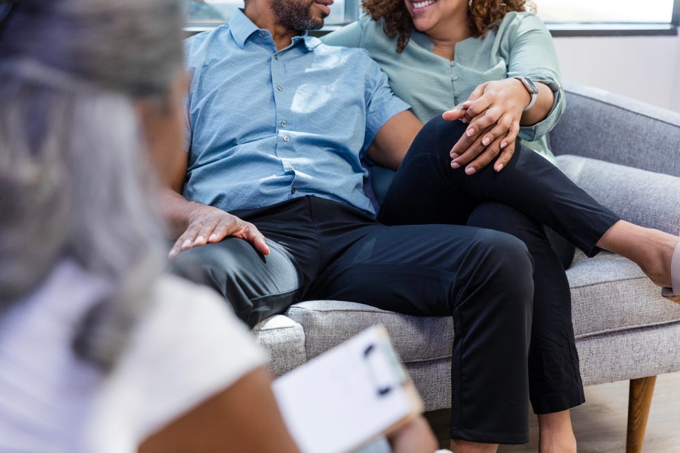 during therapy, unrecognizable couple talk together