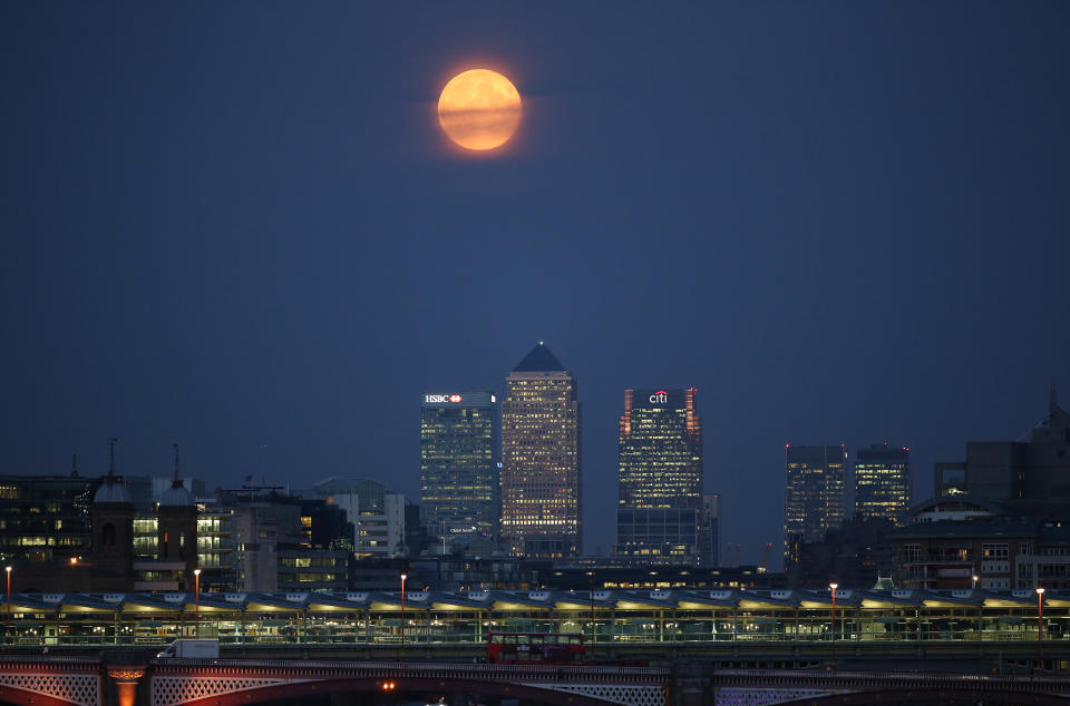 A harvest supermoon over Canary Wharf in London