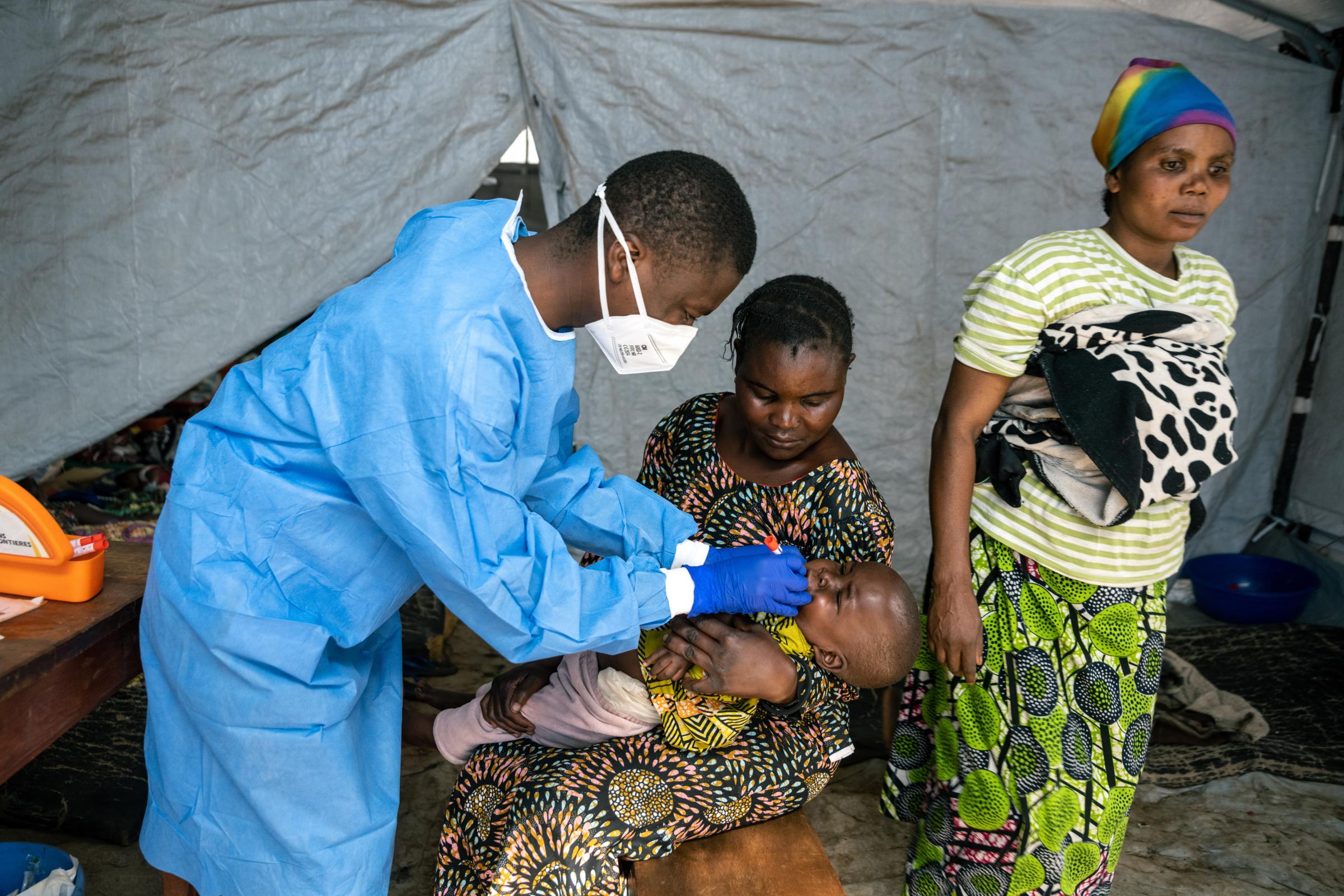 A laboratory specialist takes a sample from a patient suspected of being infected with mpox at the Kavumu hospital in Kabare territory, South Kivu region, Democratic Republic of Congo, on Sept. 3, 2024.