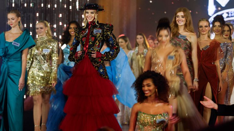 Contestants walk past Czech Republic's Krystyna Pyszkova during the "Best Designer Award" contest at the 71st Miss World pageant ahead of the finale in Mumbai, India, March 2, 2024. REUTERS/Francis Mascarenhas