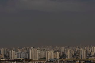 Air pollution seen over the skyline of a city.