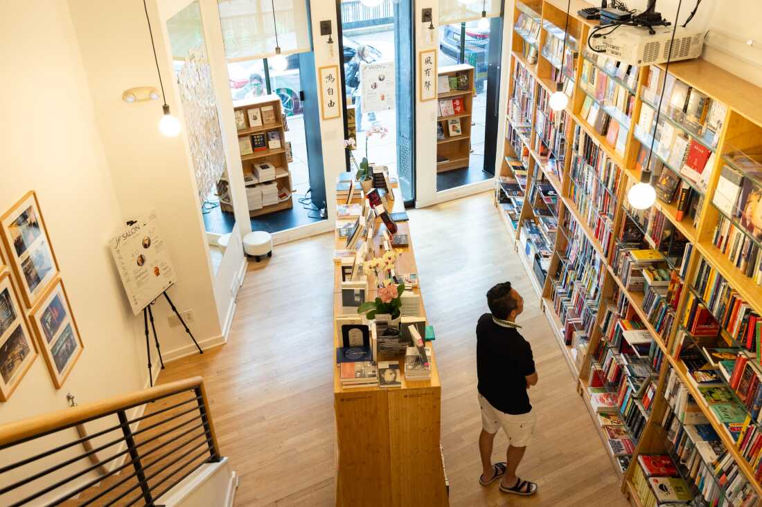 Yu Miao runs the bookstore JF Books, which sells both Chinese literature and a broad range of books on Asian and Asian American experiences, on September 17, 2024 in Washington, D.C. 