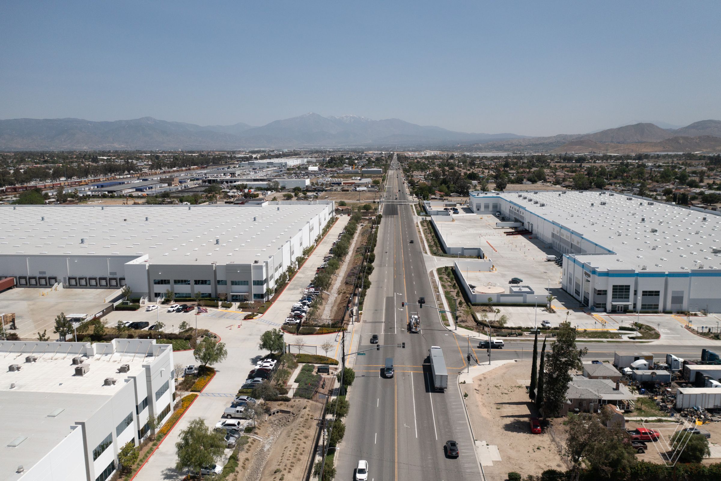 An aerial photo of a warehouse next to homes in Bloomington, California.